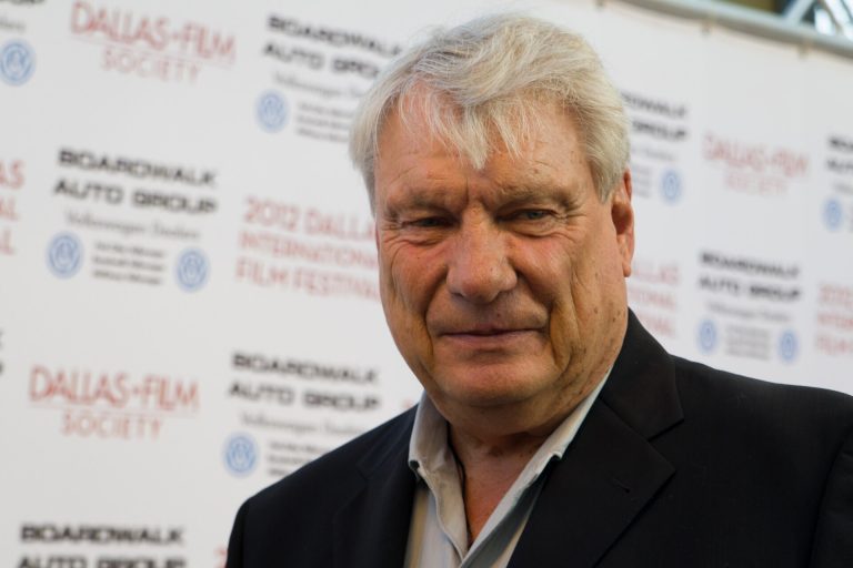 Don Nelson, NBA head coach, smiling on the sideline